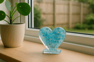 Memorial resin heart ornament placed out of direct sunlight