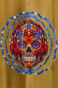 Sugar skull wind spinner with floral design – colourful metal garden decoration by Shellmon